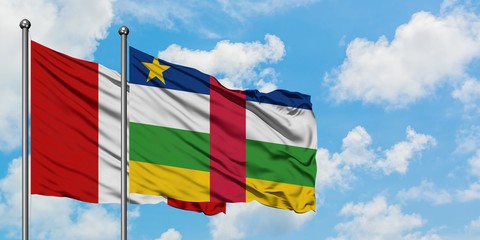 Peru and Central African Republic flag waving in the wind against white cloudy blue sky together. Diplomacy concept, international relations.