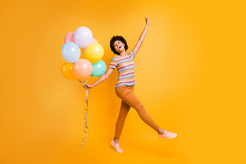 Fototapeta na wymiar Full length body size turned photo of cheerful positive cute nice charming girlfriend dancing while having birthday party wearing orange pants trousers isolated over vivid color background