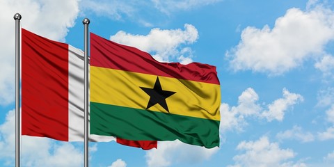 Peru and Ghana flag waving in the wind against white cloudy blue sky together. Diplomacy concept, international relations.