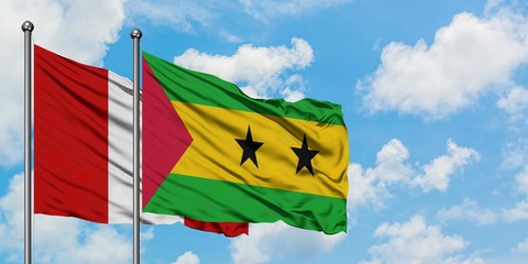 Peru and Sao Tome And Principe flag waving in the wind against white cloudy blue sky together....