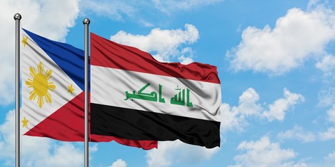 Philippines and Iraq flag waving in the wind against white cloudy blue sky together. Diplomacy concept, international relations.