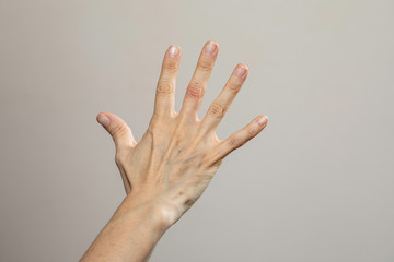 Human showing back side of hand