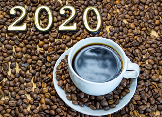 a cup of coffee with cookies, coffee grains scattered on a table near a cup with a coffee