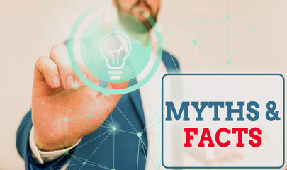 Writing note showing Myths And Facts. Business concept for usually traditional story of ostensibly...