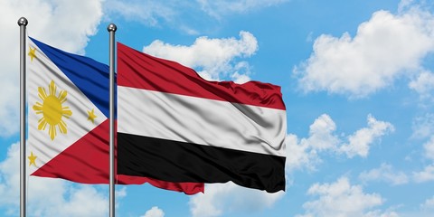 Philippines and Yemen flag waving in the wind against white cloudy blue sky together. Diplomacy concept, international relations.