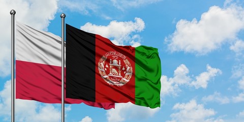 Poland and Afghanistan flag waving in the wind against white cloudy blue sky together. Diplomacy concept, international relations.