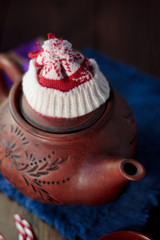 Christmas teapot with the red santa hat on it.