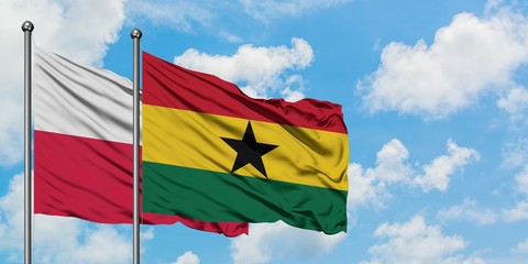 Poland and Ghana flag waving in the wind against white cloudy blue sky together. Diplomacy concept, international relations.