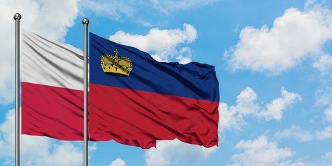 Poland and Liechtenstein flag waving in the wind against white cloudy blue sky together. Diplomacy concept, international relations.