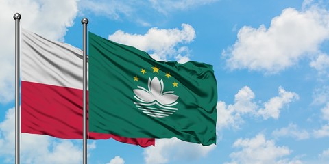 Poland and Macao flag waving in the wind against white cloudy blue sky together. Diplomacy concept, international relations.