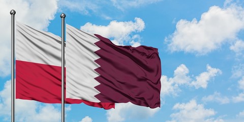 Poland and Qatar flag waving in the wind against white cloudy blue sky together. Diplomacy concept, international relations.