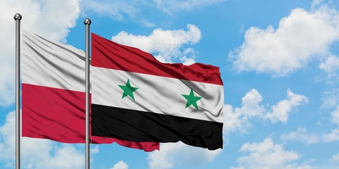 Poland and Syria flag waving in the wind against white cloudy blue sky together. Diplomacy concept,...