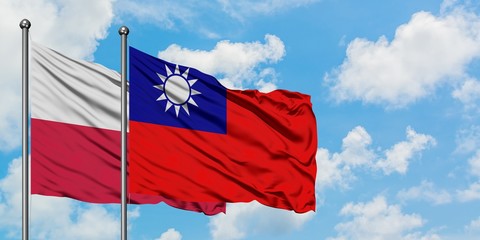 Poland and Taiwan flag waving in the wind against white cloudy blue sky together. Diplomacy concept, international relations.