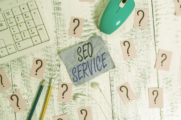 Writing note showing Seo Service. Business concept for techniques and procedures to increase the...