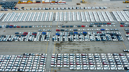 Aerial view cargo ship transportation of business logistic sea freight, New Cars produced by year up in the port for Cargo ship and Cargo import-export around in the world