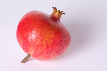 Pomegranate fruit in peel close up