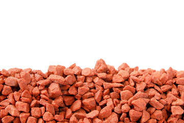 Pile of potassium chloride. Isolate. Close-up. Copy space. Potassium chloride is a red mineral fertilizer close-up. The texture of granular potassium chloride is red.