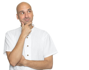 bald man in casual white shirt is looking up. Isolated