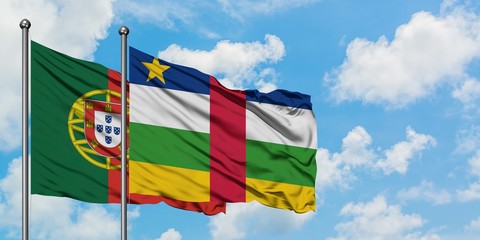 Portugal and Central African Republic flag waving in the wind against white cloudy blue sky together. Diplomacy concept, international relations.
