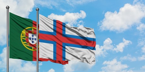 Portugal and Faroe Islands flag waving in the wind against white cloudy blue sky together. Diplomacy concept, international relations.