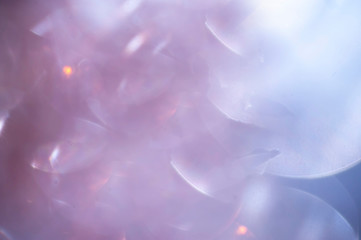 Purple violet Christmas – New Year decoration abstract background with playful bokeh light bubbles