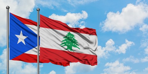 Puerto Rico and Lebanon flag waving in the wind against white cloudy blue sky together. Diplomacy concept, international relations.