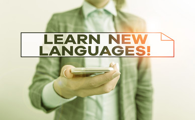 Handwriting text Learn New Languages. Conceptual photo developing ability to communicate in foreign lang Business concept with mobile phone and business woman