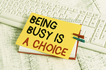 Text sign showing Being Busy Is A Choice. Business photo showcasing life is about priorities Arrange your to do list notebook paper reminder clothespin pinned sheet white keyboard light wooden
