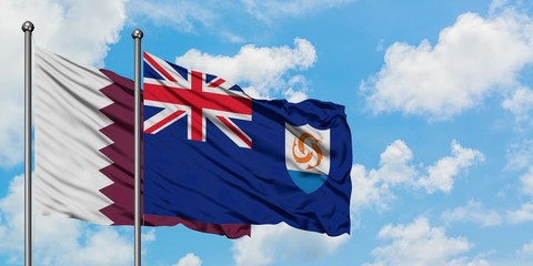 Qatar and Anguilla flag waving in the wind against white cloudy blue sky together. Diplomacy concept, international relations.