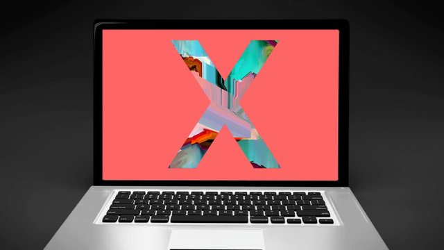 Letter X on computer laptop evoking -18 sexual content on internet, X-rated