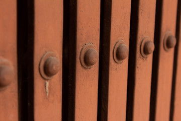 Obraz premium Rivets along the collapsible gate used for additional security for homes and businesses