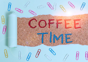 Handwriting text Coffee Time. Conceptual photo a short period of time in which you stop working to rest Paper clip and torn cardboard placed above a wooden classic table backdrop