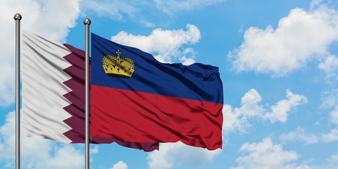 Qatar and Liechtenstein flag waving in the wind against white cloudy blue sky together. Diplomacy concept, international relations.