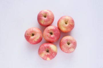 Red ripe apples close-up on a white background. Top view.