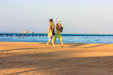 Ladies strolling along the Red Sea