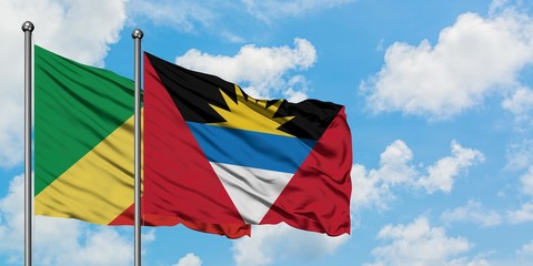 Republic Of The Congo and Antigua and Barbuda flag waving in the wind against white cloudy blue sky together. Diplomacy concept, international relations.