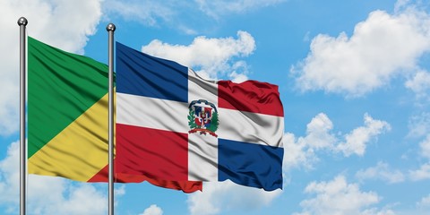 Republic Of The Congo and Dominican Republic flag waving in the wind against white cloudy blue sky together. Diplomacy concept, international relations.