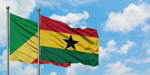 Republic Of The Congo and Ghana flag waving in the wind against white cloudy blue sky together. Diplomacy concept, international relations.
