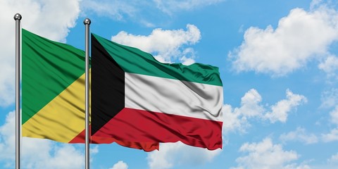 Republic Of The Congo and Kuwait flag waving in the wind against white cloudy blue sky together. Diplomacy concept, international relations.