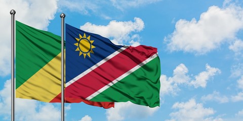 Republic Of The Congo and Namibia flag waving in the wind against white cloudy blue sky together. Diplomacy concept, international relations.