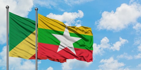 Republic Of The Congo and Myanmar flag waving in the wind against white cloudy blue sky together. Diplomacy concept, international relations.