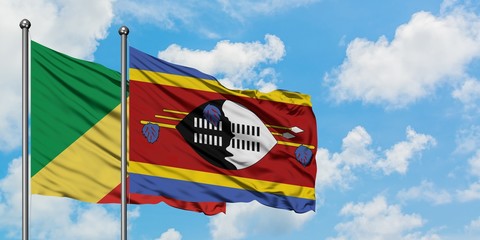 Republic Of The Congo and Swaziland flag waving in the wind against white cloudy blue sky together. Diplomacy concept, international relations.