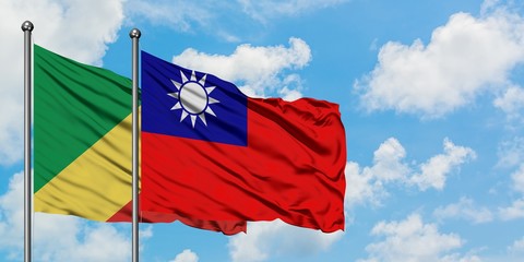 Republic Of The Congo and Taiwan flag waving in the wind against white cloudy blue sky together. Diplomacy concept, international relations.