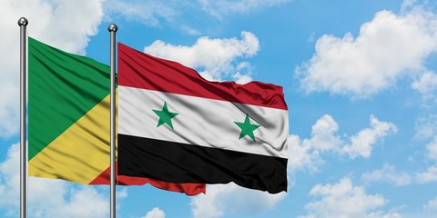 Republic Of The Congo and Syria flag waving in the wind against white cloudy blue sky together. Diplomacy concept, international relations.