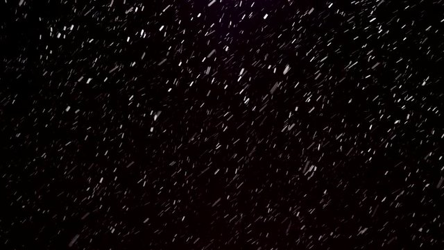 Winter falling snow isolated on a black background for animation graphics and composition. Blizzard, big and small snowflakes, real, intense. 4k footage.