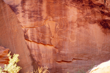 Detail of a part of the petroglyphs incised by the Fremont People in the sandstone rock face at Dinosaur National Monument, Utah