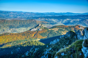 Fototapeta na wymiar Mountains and hills with trees colored in autumn colors, Slovakia Mala Fatra
