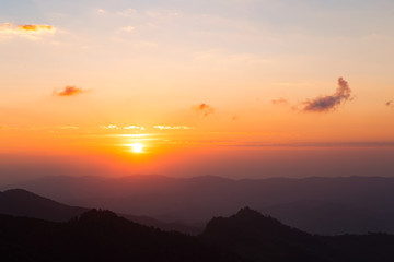 Colorful color clear sky with cloud and silhouette mountains at dawn time before sunrise, take photo from top of mountain in Thailand