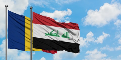 Romania and Iraq flag waving in the wind against white cloudy blue sky together. Diplomacy concept, international relations.