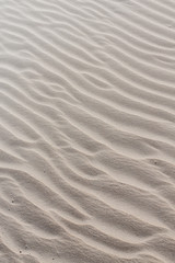 Fototapeta na wymiar Sandverwehungen in Wellenform